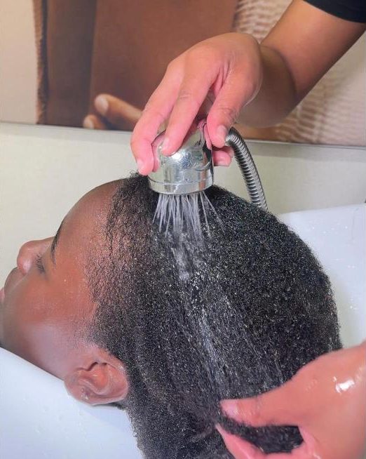 Natural hair wash and treatment at the basin