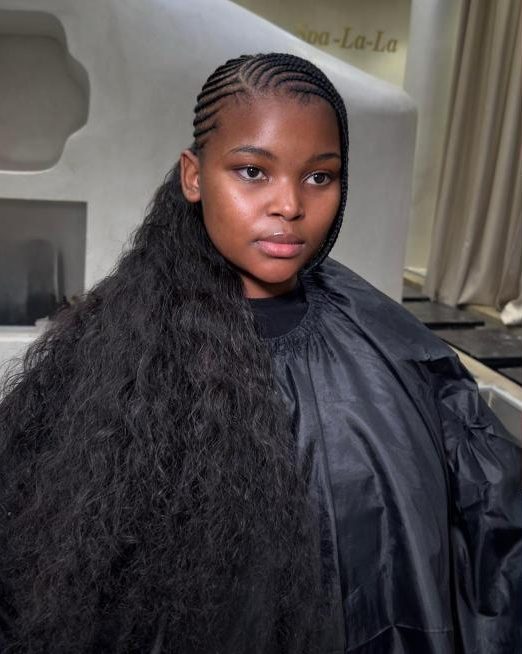 Straight-up braids with long curly extensions