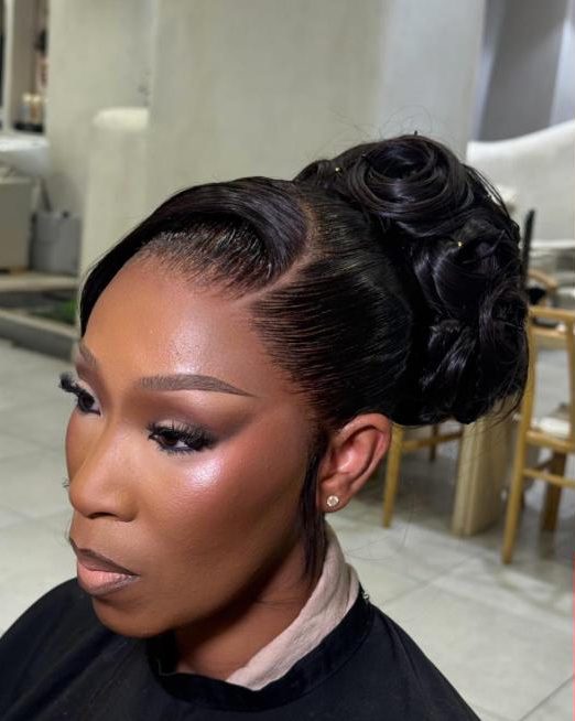 Sculpted bridal updo with glam makeup